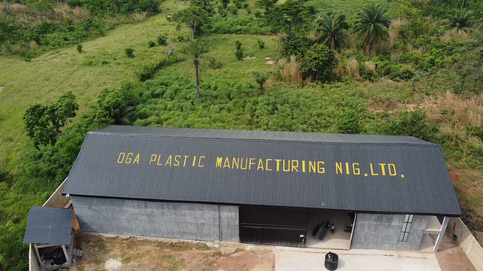 OGA PLASTIC factory — front view with roof branding